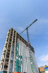 Construction of a high-rise building with a crane