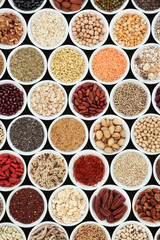Dried high fibre health food with cereals, nuts, seeds, grain, fruit, spice and legumes with foods high in omega 3 fatty acid, antioxidants and vitamins, top view.