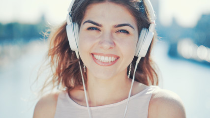 Happy smiling girl listen to music