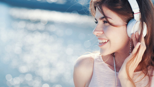 Smiling woman listen to music