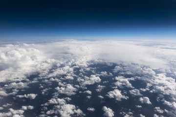Obraz na płótnie Canvas Beautiful view from window of airplane in blue sky