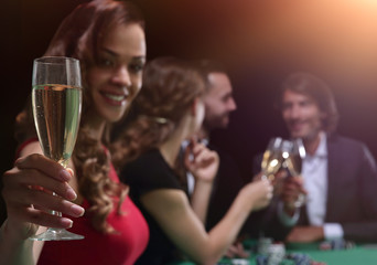 adult group celebrating friend winning blackjack