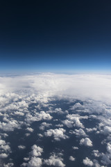 Fototapeta na wymiar Beautiful view from window of airplane in blue sky
