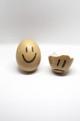 Story of broken heart written by the shells of eggs on the white background
