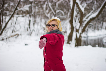 Fototapeta na wymiar Happy woman in a winter forest