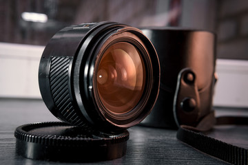 Close-up shot of photo lens on a table.camera accessories, photographer concept design