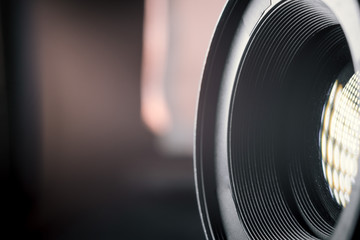Photo Camera or Video lens close-up on black background, objective, concept of photographer camera...