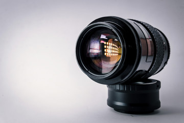 Close-up shot of photo lens on a white background.camera accessories, photographer concept design