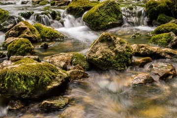 Fototapeta na wymiar Mountain river with cascade