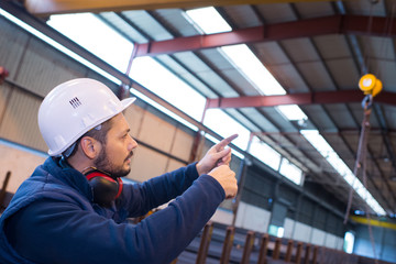 construction worker with helmet in warehouse