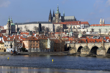 Early Spring Prague gothic Castle and Charles Bridge with the Lesser Town in the sunny Day, Czech Republic