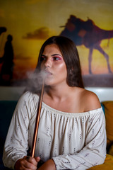 Young girl smoking shisha