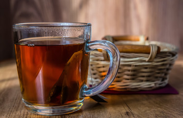 mug with tea and wicker basket on the table