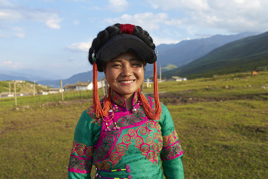 Beautiful Chinese Yi people in traditional costumes  outdoor