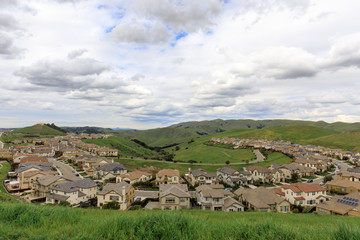 Residential Homes in Dublin Hills with approaching storm clouds in the winter. Dublin Hills...