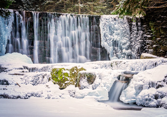 Fototapeta premium Wild waterfall in winter
