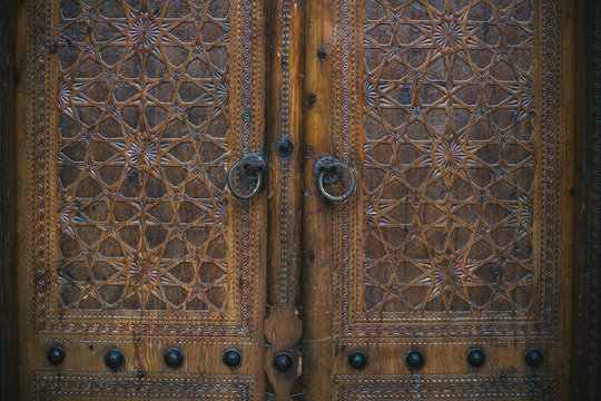 beautiful ornate wooden door of uzbek mosque