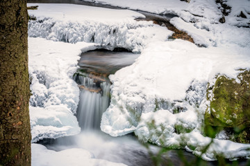 Fototapeta premium Wild waterfall detail in winter