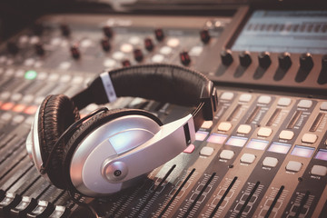 Fototapeta na wymiar Digital music controller and audio mixer for dj party with modern headphones