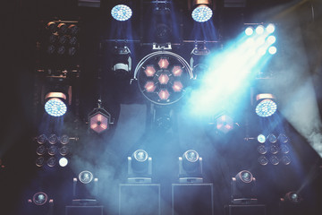 stage lights during a music concer or festival with smoke