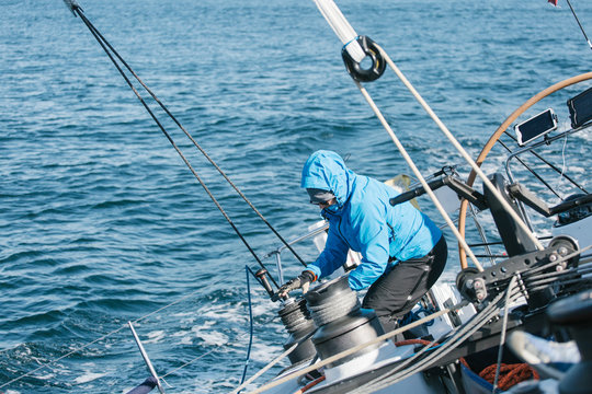 Crew on a racing sailboat or yacht