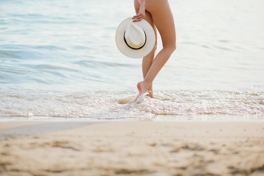 Fototapeta Young woman on the beach