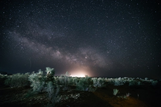 milky way above uzbek desert landscape