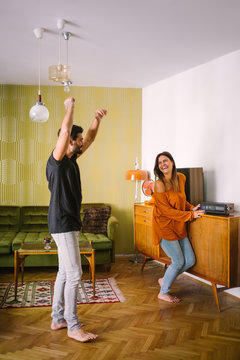 Couple Having Fun Dancing in the Apartment