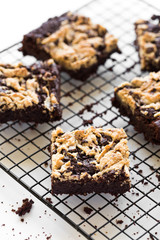 Chocolate Vegan Brownie with Tahini Swirls Cut into Pieces on a Cooling Wired Wrack 