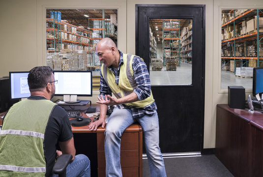 Warehouse workers in office
