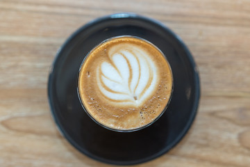 Hot coffee cup on wooden table