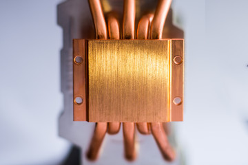 Aluminum radiator with copper heat pipe close-up with beautiful bokeh Concept of air cooling of the...