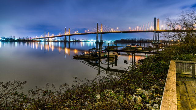 The Golden Ears Bridge, conecting Maple Ridge to Langley. Long exposure at night, reflecting into Fraser River.