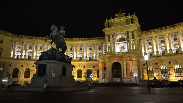 Statue in front of Hofburg palace in Vienna at night