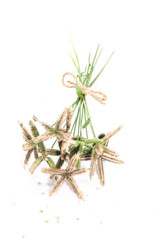 Closeup of bouquet Crowfoot grass or Beach wiregrass or Egyptian crowfoot grass on brown wooden