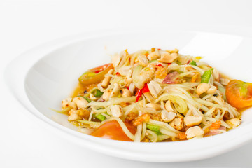 Traditional thai cuisine scipy green papaya salad on white background