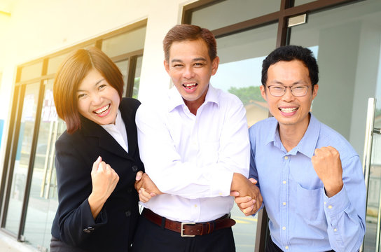 Excited asian business team
