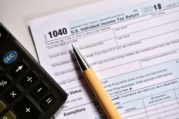 Naklejka premium American tax form 1040 on white background. Fill-up American tax form.