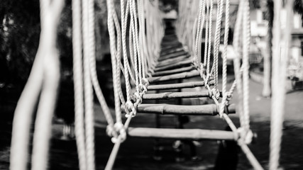 bridge made of ropes and wood for crossing river and adventure sports