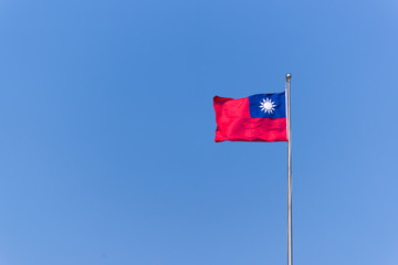 Taiwan or Republic of China flag waving over the blue sky
