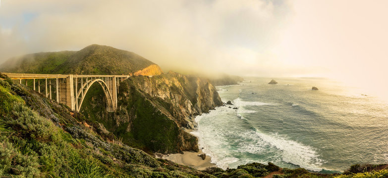 A sweeping panoramic view of Bixby bridge, along the Big Sur coast in northern California.
