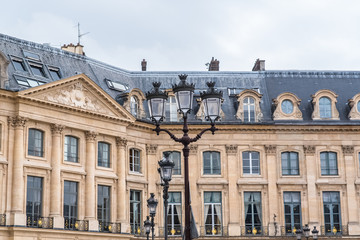 Paris, place Vendome, beautiful buildings, ancient lamppost
