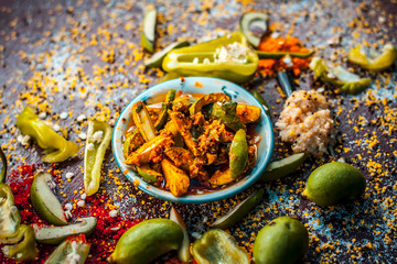 Close up of Aam ka achar or kari ka achar or traditional raw mango pickle with all its ingredients...
