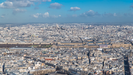 Fototapeta premium Paris, panorama, aerial view, the Louvre museum and Tuileries garden, and Sacre-Choeur church in background 