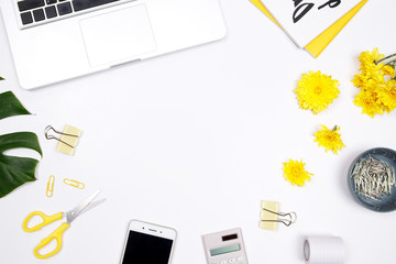 Woman workspace with laptop, handwritten quote notebook, yellow flower and smartphone on white background. Flat lay, top view. stylish female blogger concept. spring summer background.
