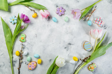 Easter concept - cookies with flowers on marble background