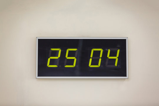 Black digital clock on a white background showing DNA