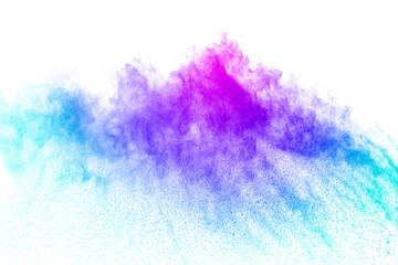 abstract multicolored powder splatter on white background. Freeze motion of color powder explosion...