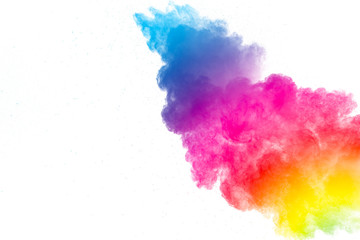 abstract multicolored powder splatter on white background. Freeze motion of color powder explosion on white background.