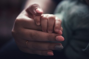 hand of mother and child, care love